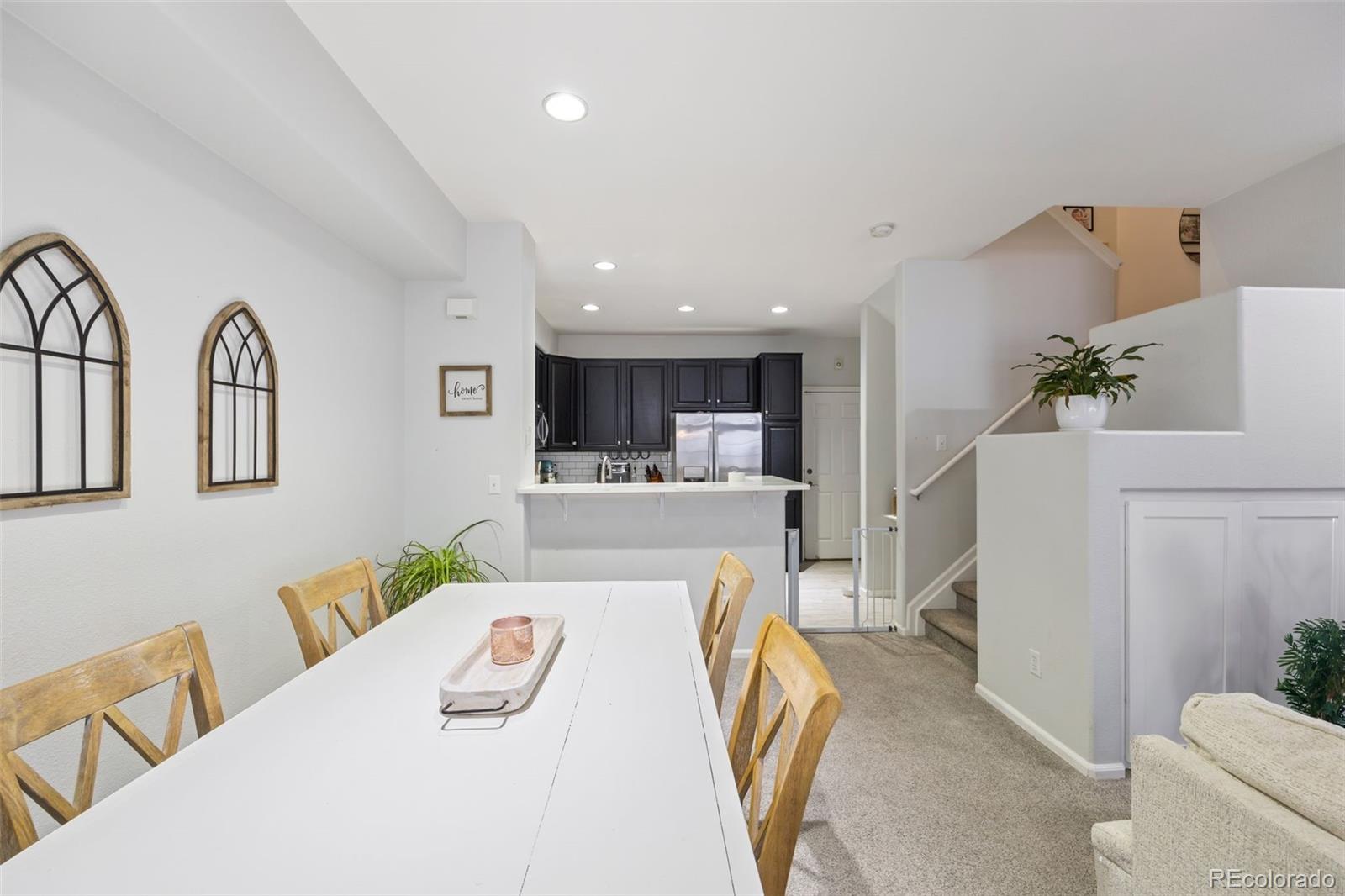8419 Stonybridge Circle Highlands Ranch, CO 80126 - Photo 9 of 24 a living room with furniture and a wooden floor