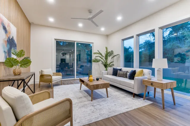 a living room with furniture and a large window