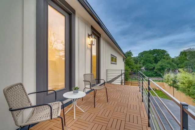 a view of balcony with furniture