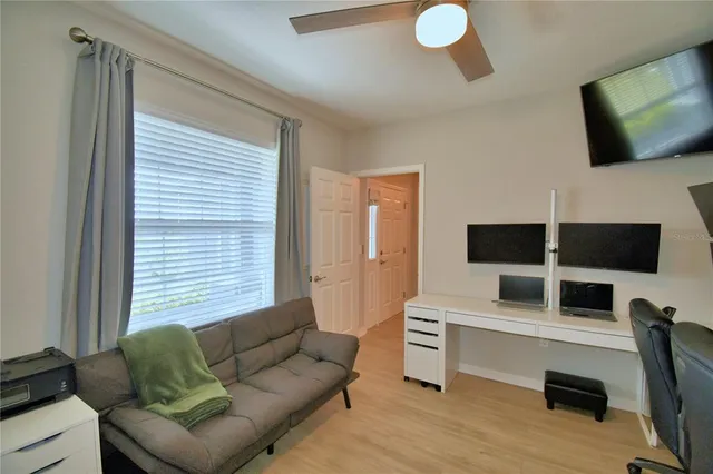 a bedroom with bed and window