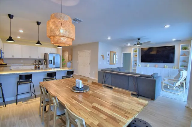 a view of a kitchen cabinets and wooden floor