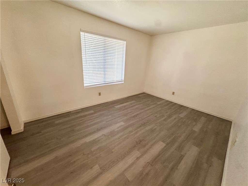 2064 Mesquite Lane, Unit 102 Laughlin, NV 89029 - Photo 13 of 22 Unfurnished room featuring dark wood-type flooring