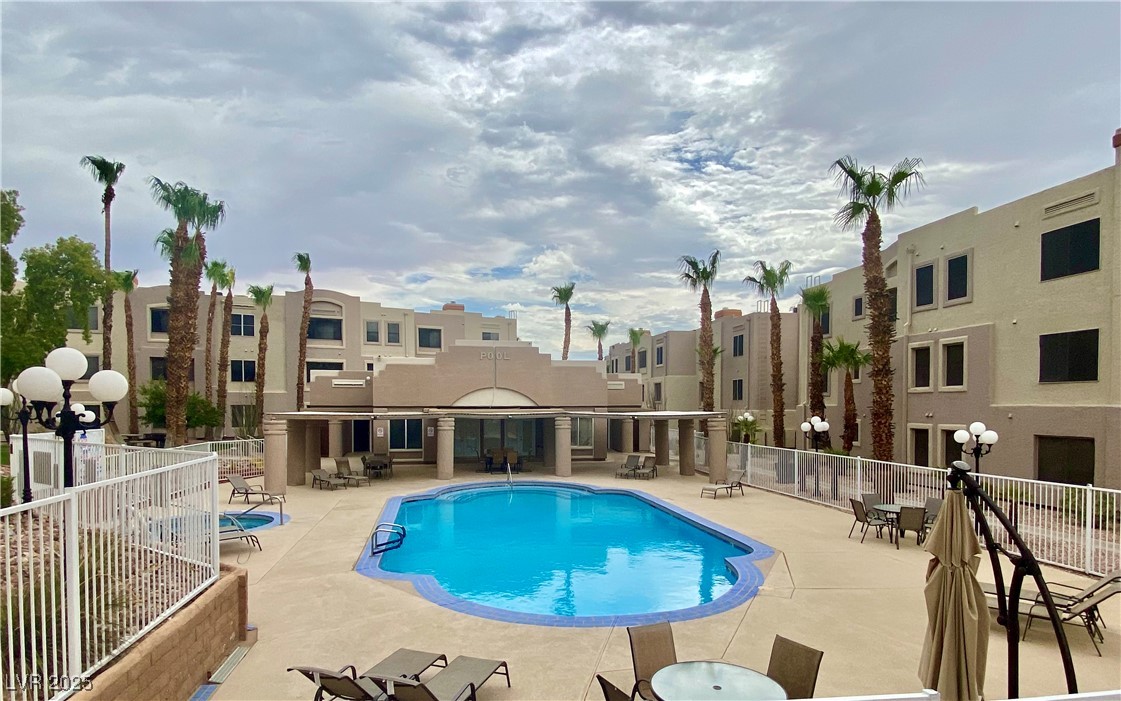 2064 Mesquite Lane, Unit 102 Laughlin, NV 89029 - Photo 17 of 22 Community pool featuring a patio area