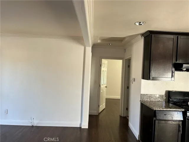 a view of a kitchen from the hallway