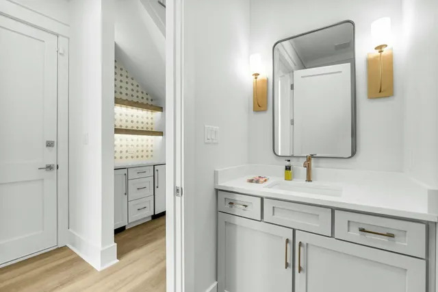 a en suite bathroom with a sink and mirror