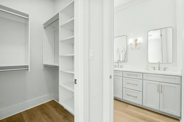 a bathroom with a double vanity sink and mirror
