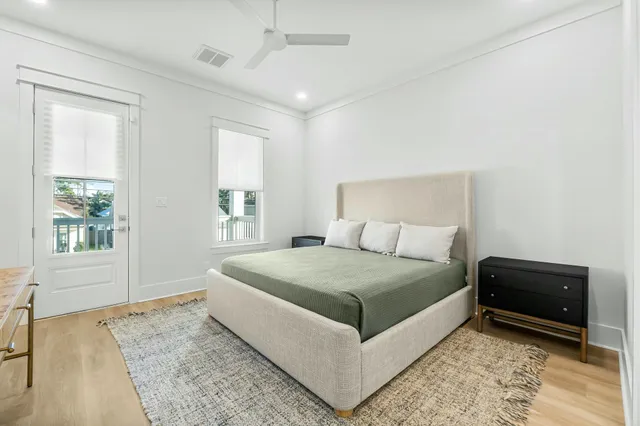 a living room with a bed and a window