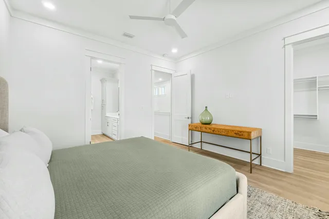 a bedroom with a bed and a table