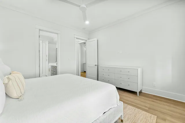 a bedroom with a bed and a dresser