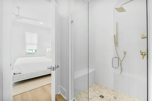 a bathroom with a bathtub and shower