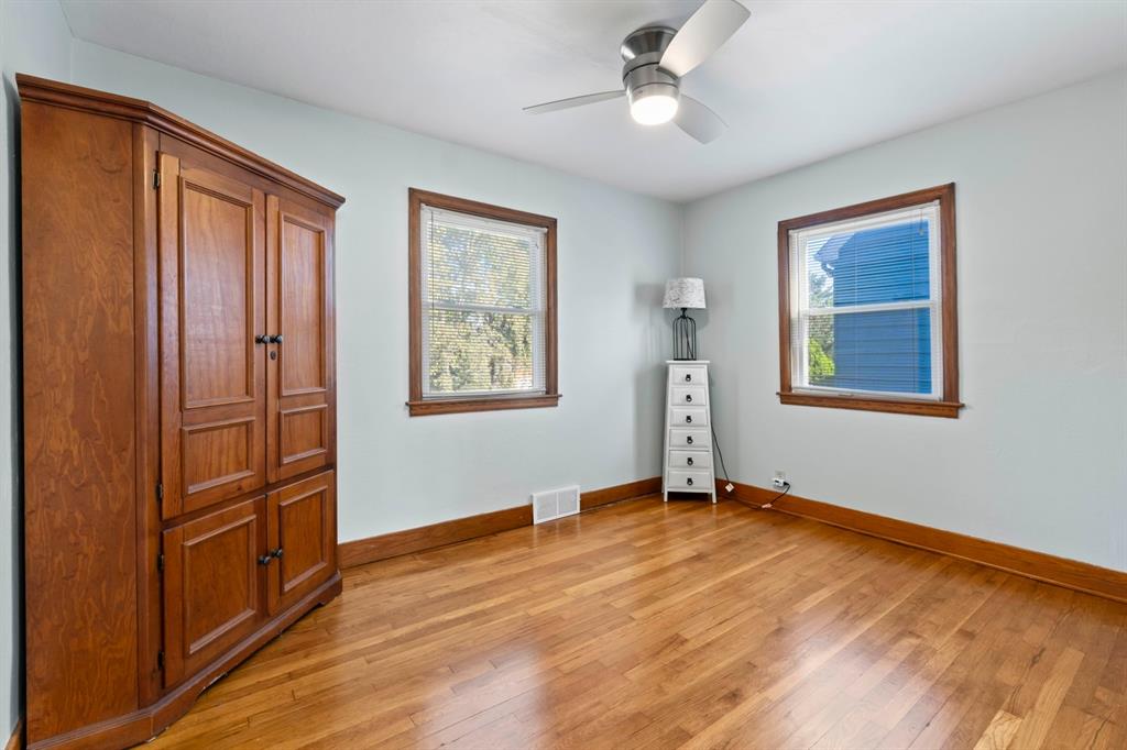 339 Center Road Monroeville, PA 15146 - Photo 16 of 43 1st Floor Bedroom with beautiful hardwood floors and a ceiling fan/light combo.