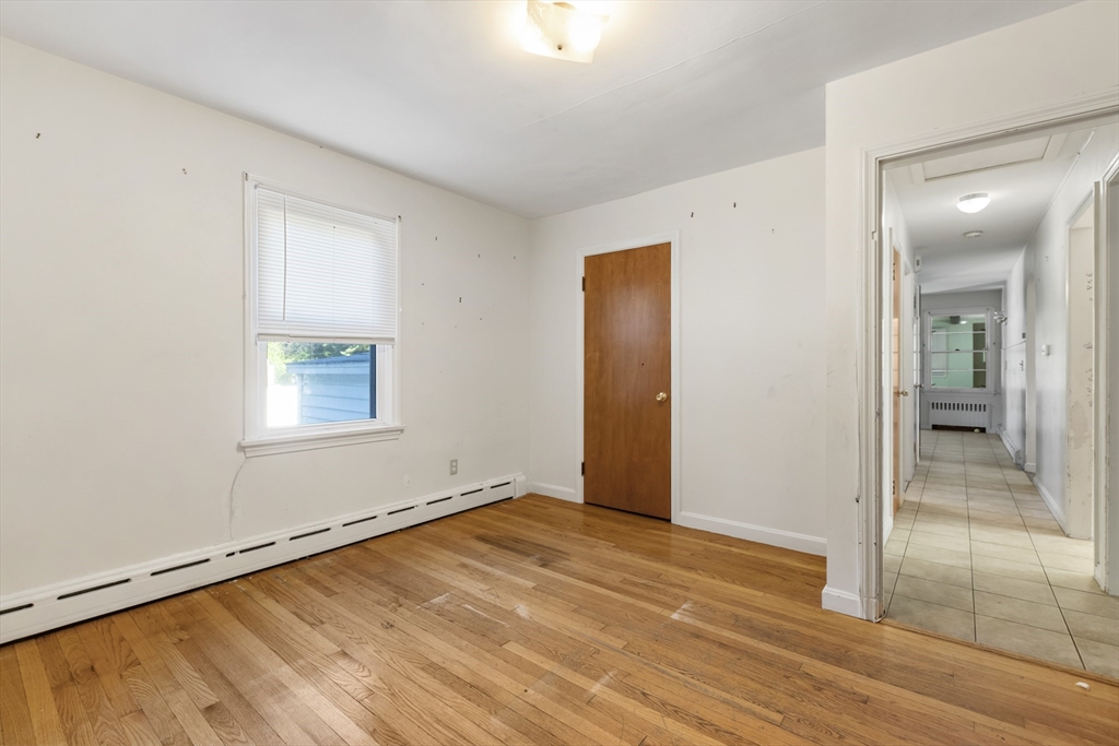 150 Gilbert Street Mansfield, MA 02048 - Photo 13 of 41 an empty room with wooden floor and windows