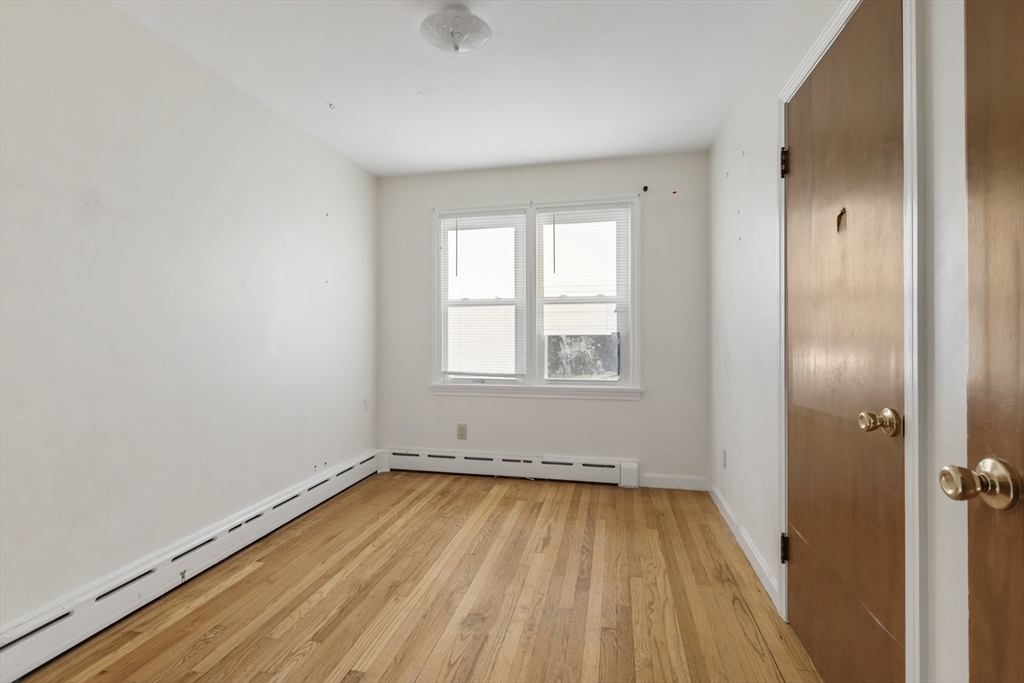 150 Gilbert Street Mansfield, MA 02048 - Photo 16 of 41 an empty room with wooden floor and windows