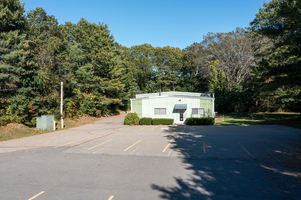 150 Gilbert Street Mansfield, MA 02048 - Photo 22 of 41 a front view of a house with a yard and garage