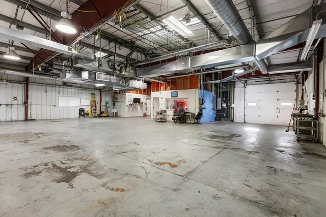 a view of parking garage with cars