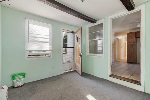 a view of a room that has a bed