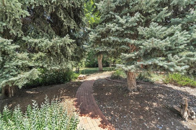a view of a street with a yard