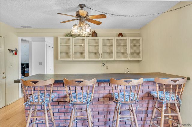 a front view of a house with wooden floor and windows