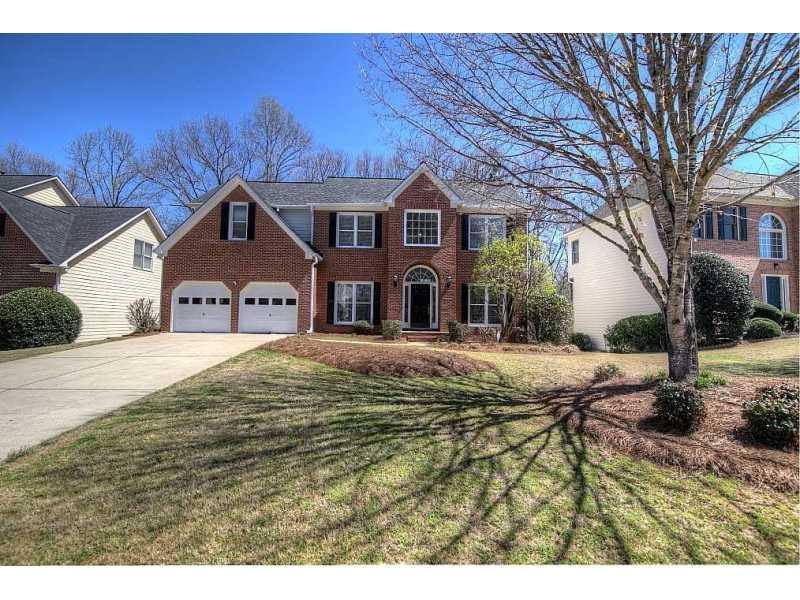 Exterior Front. Gorgeous Brick Front home in close-in Alpharetta! 3 Sides Cement Siding.