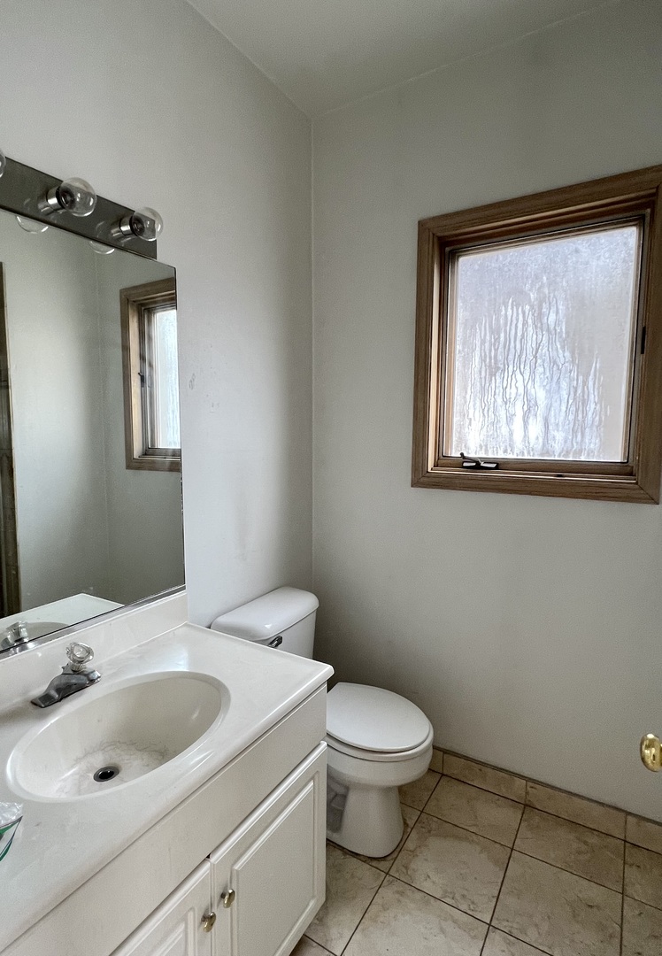 1238 North Cleaver Street, Unit 3 Chicago, IL 60642 - Photo 12 of 16 a bathroom with a sink and toilet