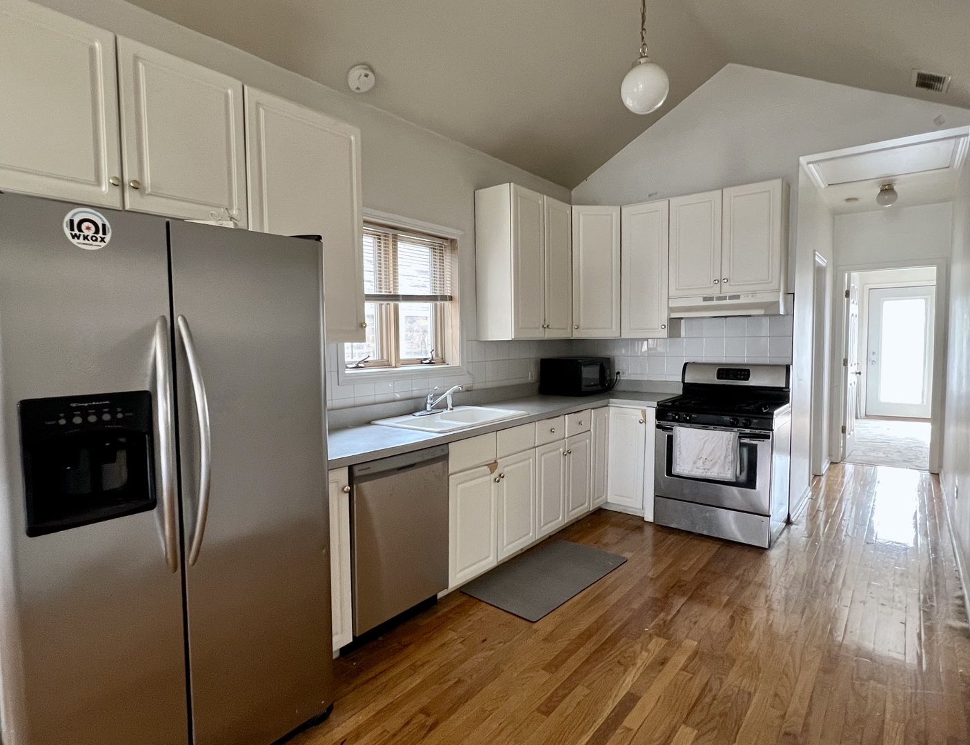 1238 North Cleaver Street, Unit 3 Chicago, IL 60642 - Photo 2 of 16 a kitchen with stainless steel appliances a refrigerator sink and microwave