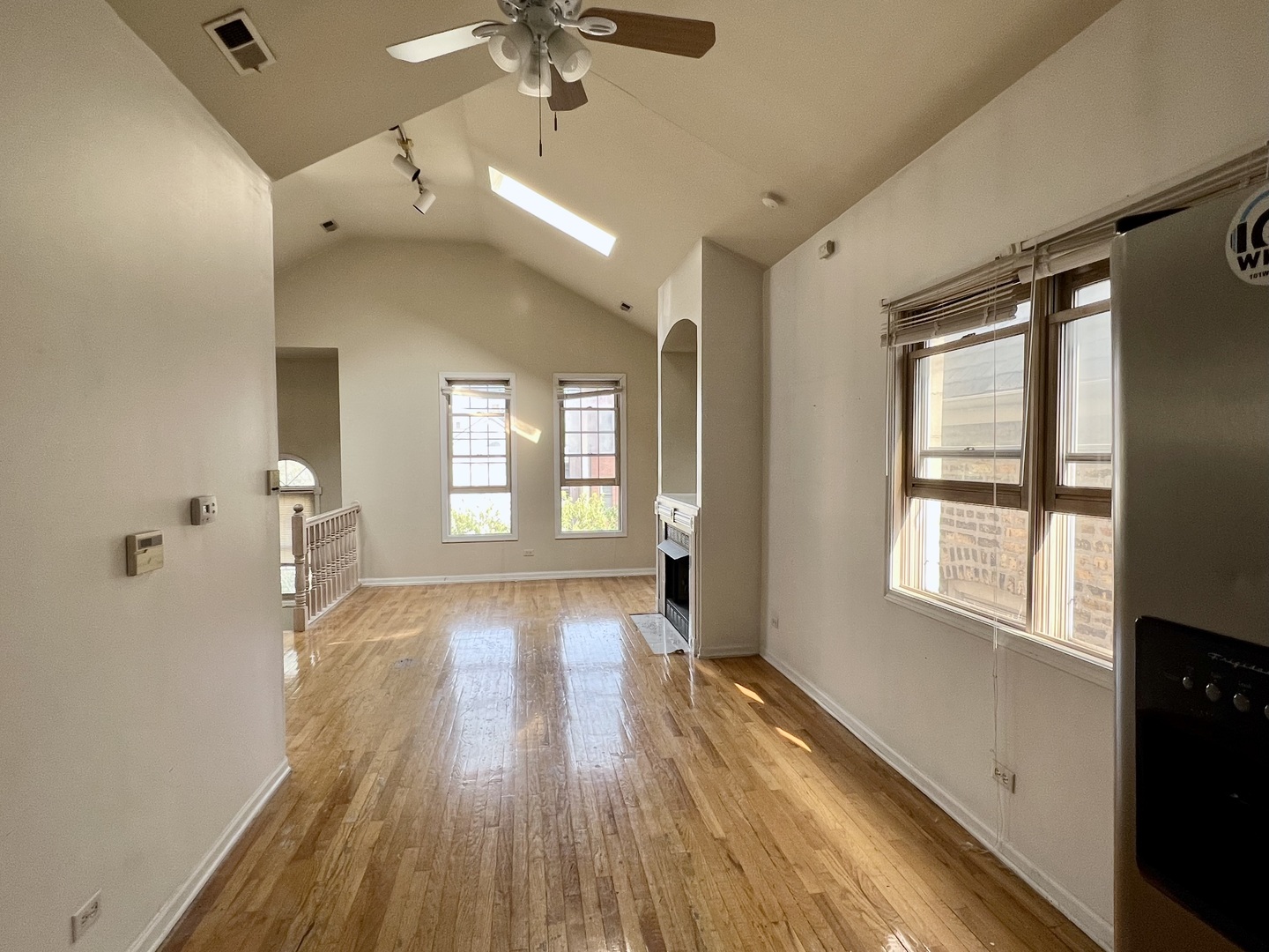 1238 North Cleaver Street, Unit 3 Chicago, IL 60642 - Photo 4 of 16 a view of an empty room with wooden floor and a window
