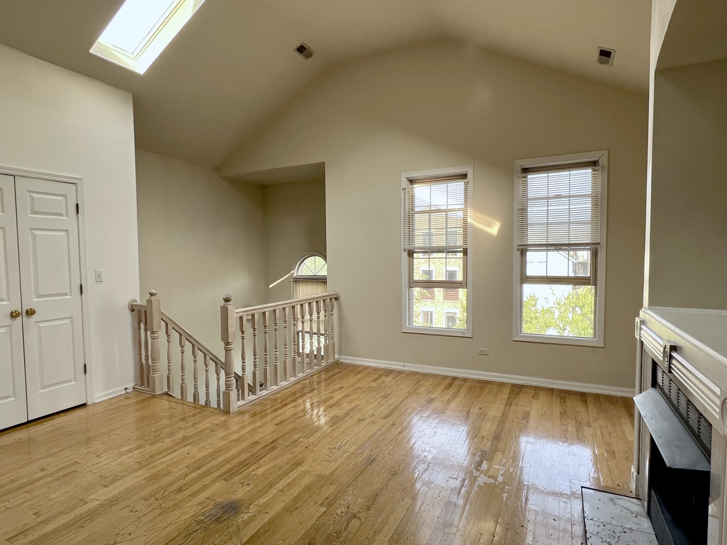 1238 North Cleaver Street, Unit 3 Chicago, IL 60642 - Photo 6 of 16 a view of an empty room with window and wooden floor