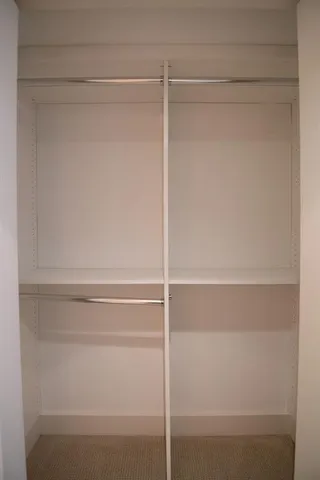 a view of an empty walk in closet