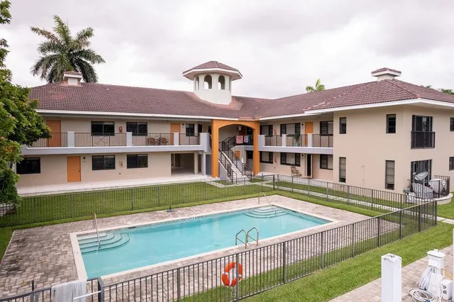 a view of a house with a swimming pool