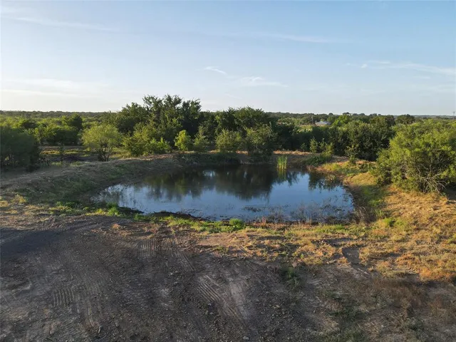 a view of a lake with houses in the background