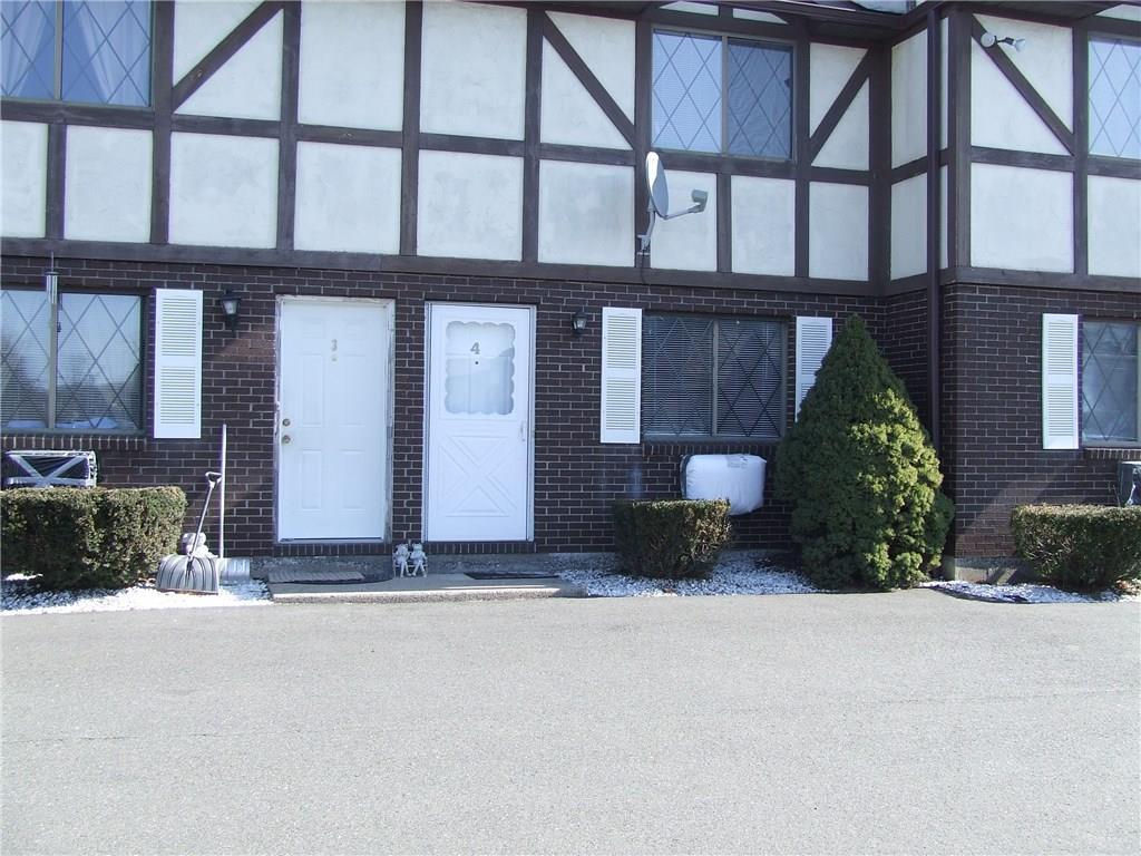 a view of a building with a yard