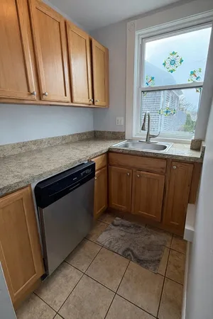a kitchen with stainless steel appliances granite countertop a sink and a cabinets