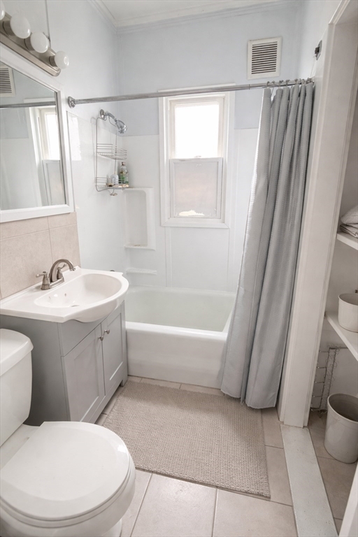 7 Judson Street, Unit 1 Beverly, MA 01915 - Photo 9 of 11 a bathroom with a sink toilet and shower