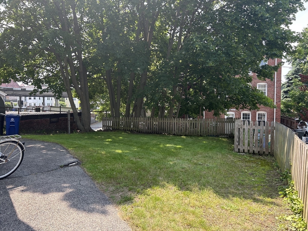 7 Judson Street, Unit 1 Beverly, MA 01915 - Photo 10 of 11 a view of a backyard with a garden