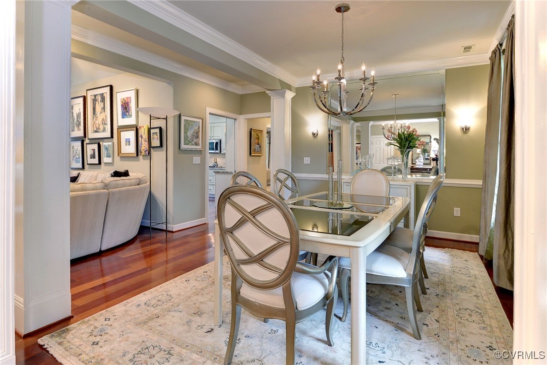 108 Harlech Williamsburg, VA 23188 - Photo 19 of 50 a dining room with furniture a chandelier and wooden floor