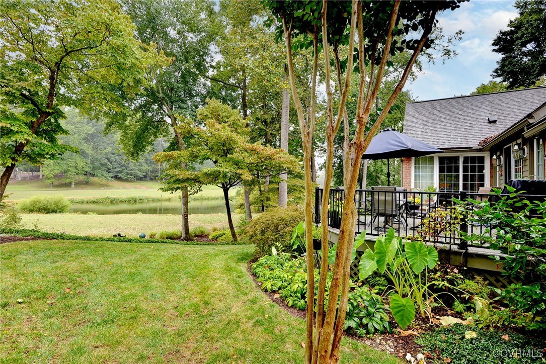 108 Harlech Williamsburg, VA 23188 - Photo 5 of 50 a view of a garden with plants and a bench