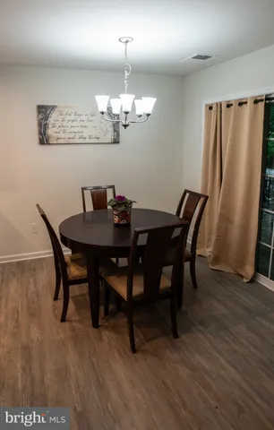 a view of a hallway with a chair
