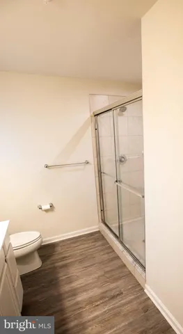 a bathroom with a glass shower door