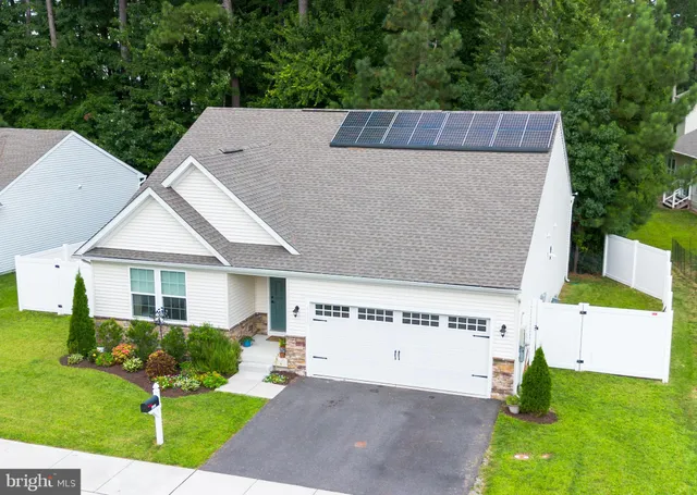 a aerial view of a house with a yard