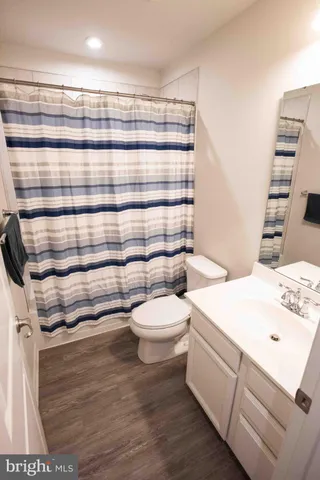 a bedroom with a bed and a desk