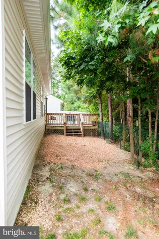 a view of balcony with furniture and wooden deck