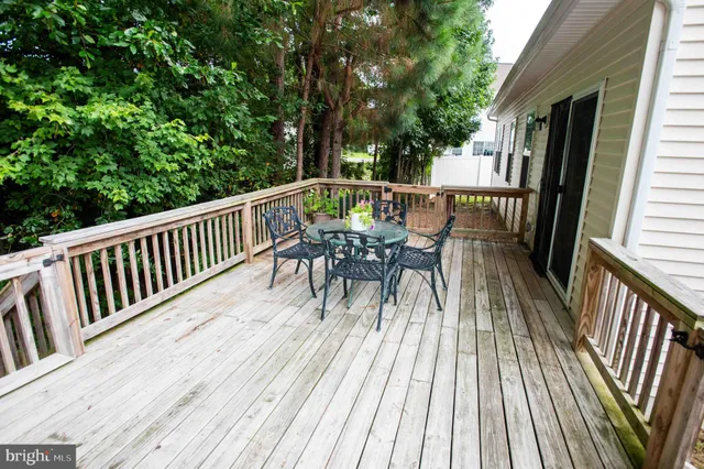a view of a house with a patio and wooden floor