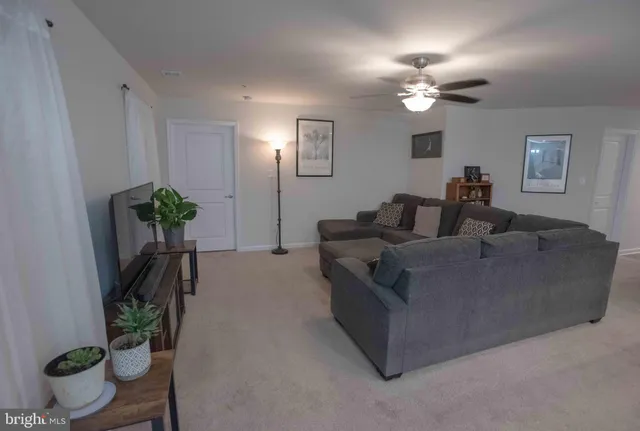 a view of living room kitchen with furniture and a flat screen tv