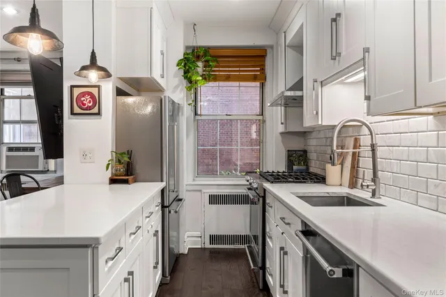 a kitchen that has a sink and a stove