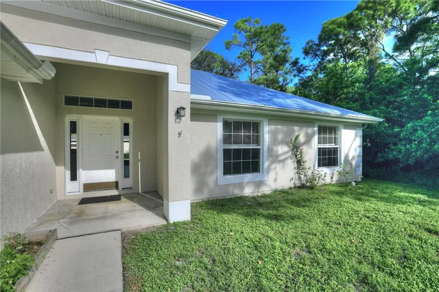 a kitchen with a stove a sink and a refrigerator