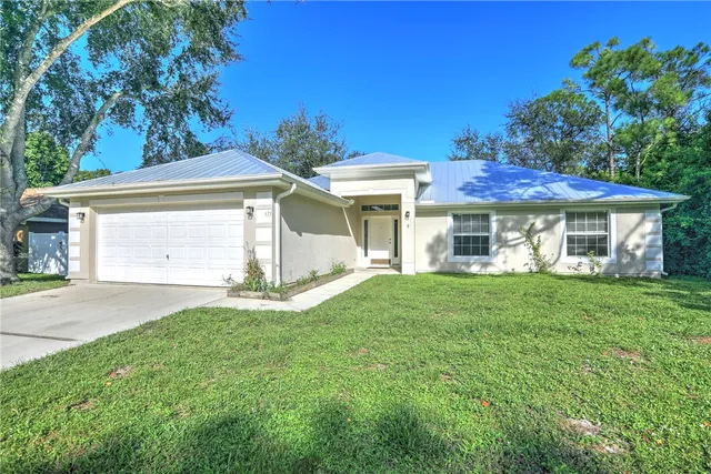 front view of a house with a garden