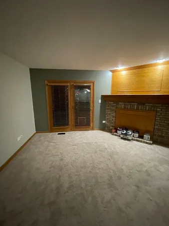 an empty room with a fireplace