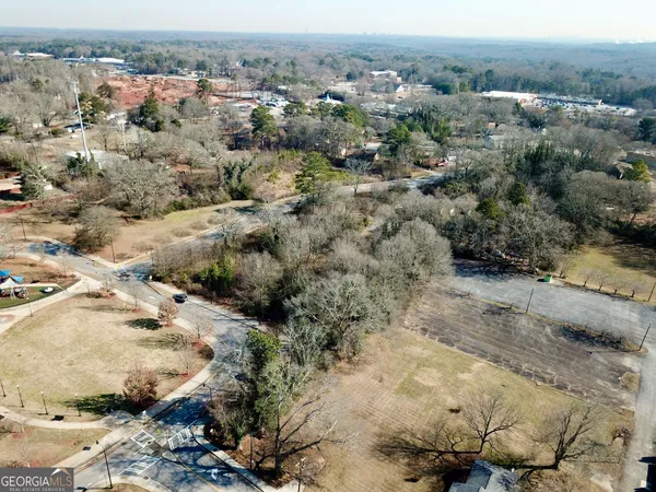 an aerial view of a residential houses with outdoor space