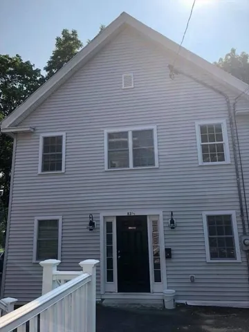 a front view of a house with glass windows