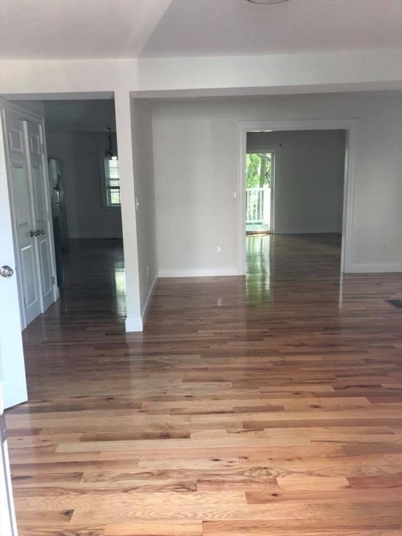 83.5 Market Street, Unit 83 5 Amesbury, MA 01913 - Photo 2 of 10 a view of empty room with wooden floor